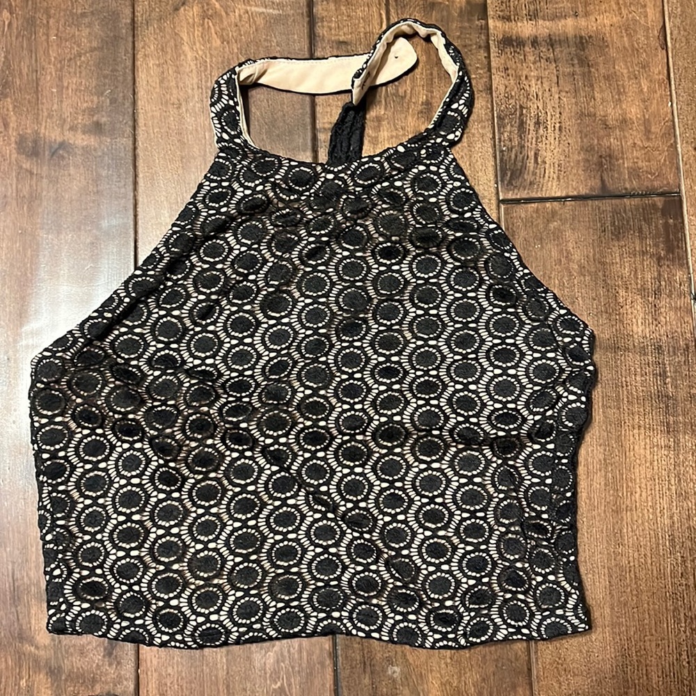 Crop top buttons around neck.